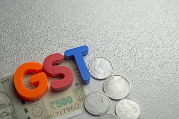 Goods and Services Tax India GST words on white textured background gst india stock pictures, royalty-free photos & images